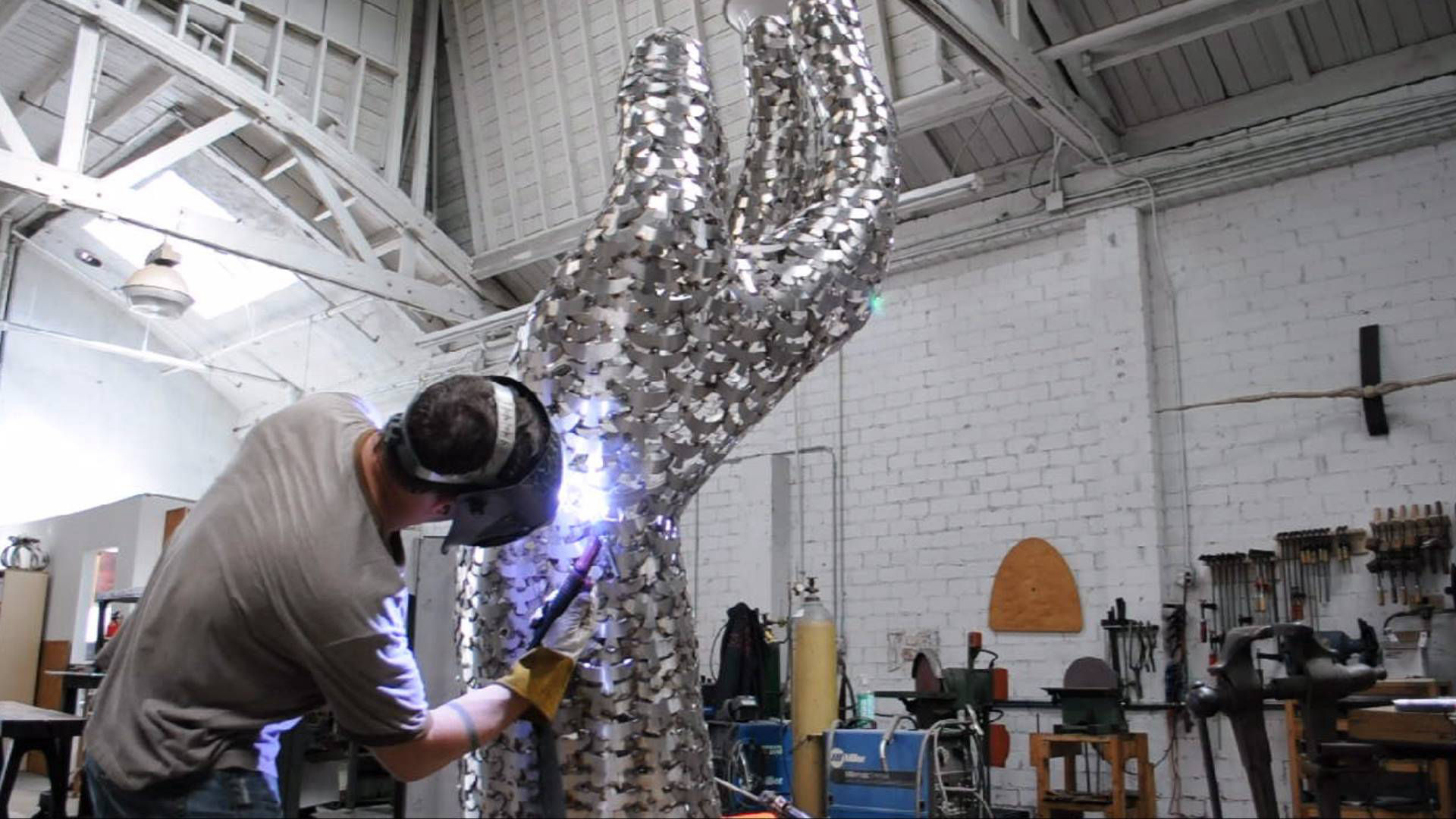 Heath Satow Sculpture - Welding the 9/11 memorial, a polished stainless steel art sculpture by Heath Satow in Rosemead, CA