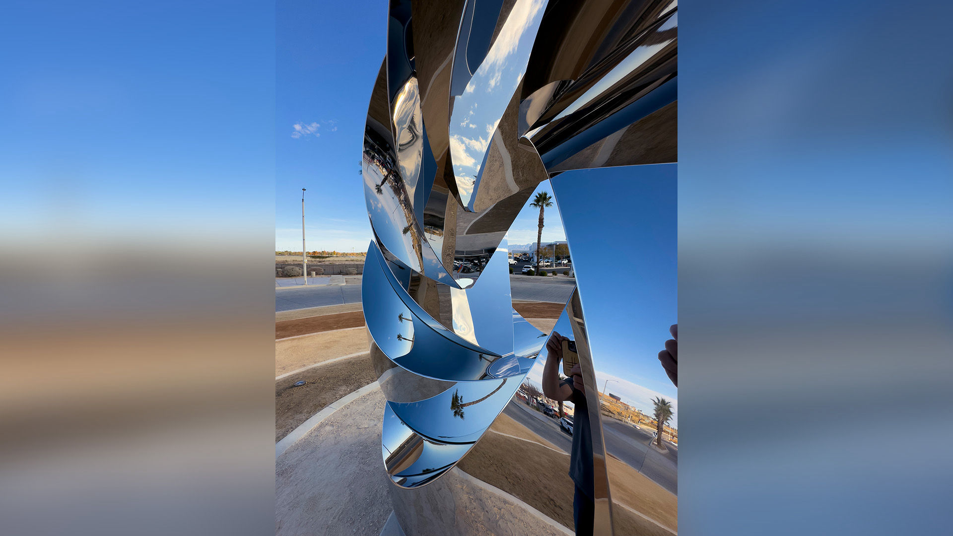 Polished stainless steel public art sculpture by Heath Satow Palmdale California