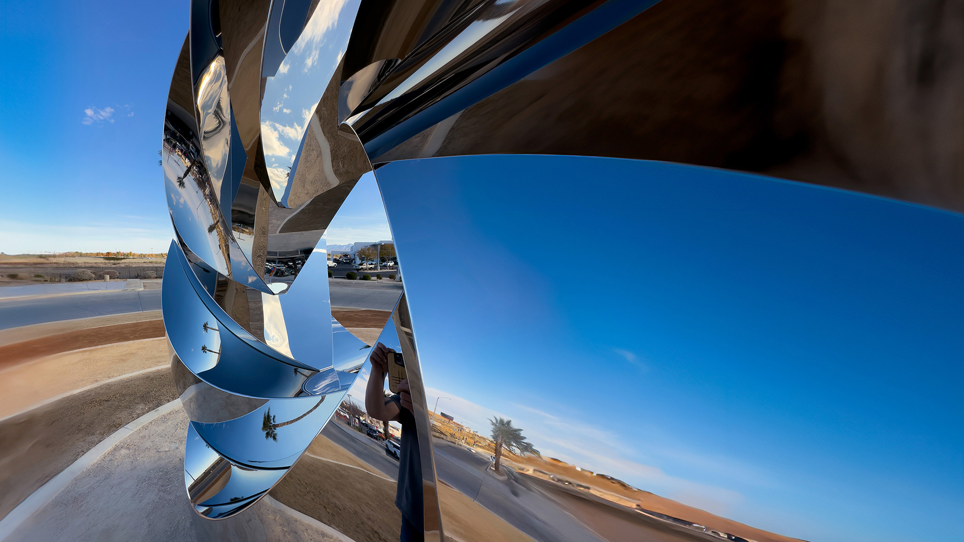 Revolution — mirror-polished stainless steel public art sculpture by Heath Satow, Palmdale, CA
