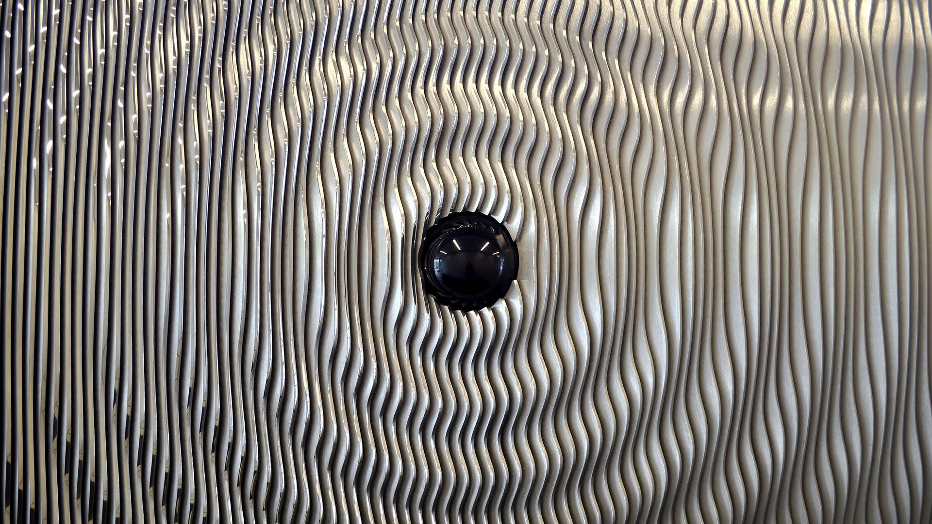Ripple — polished aluminum and granite public art sculpture by Heath Satow, Los Angeles, CA