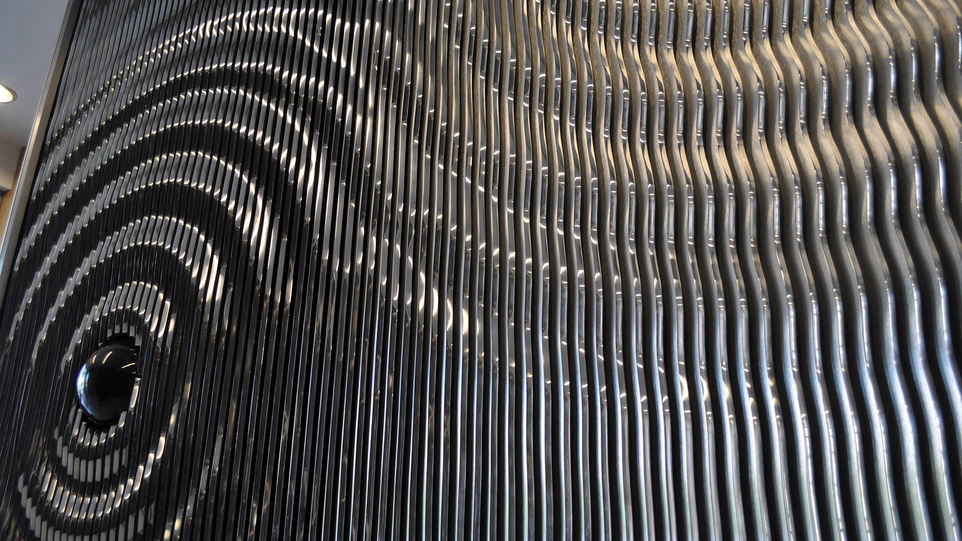 Ripple — polished aluminum and granite public art sculpture by Heath Satow, Los Angeles, CA