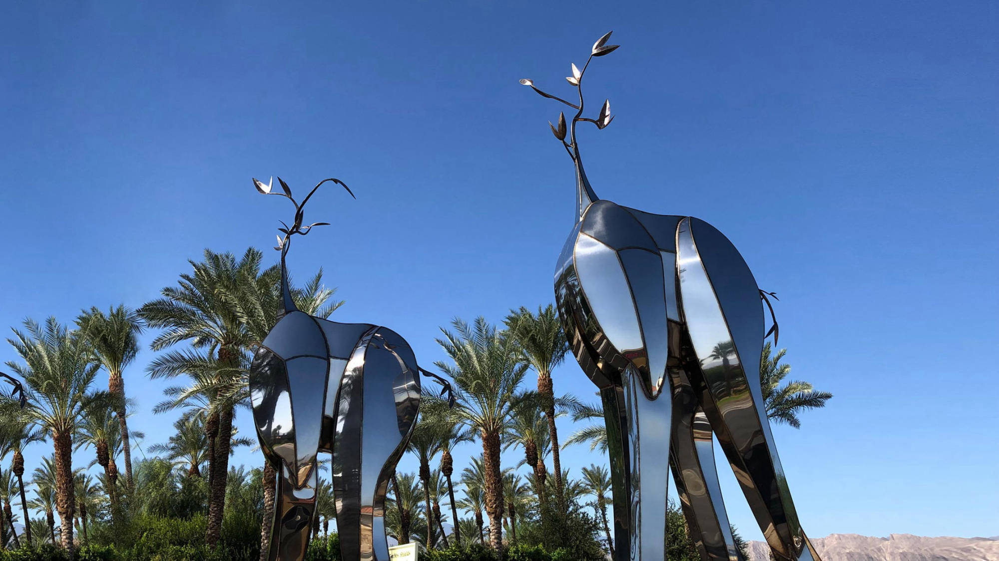Sequitur — mirror-polished stainless steel public art sculpture by Heath Satow, Indio, CA