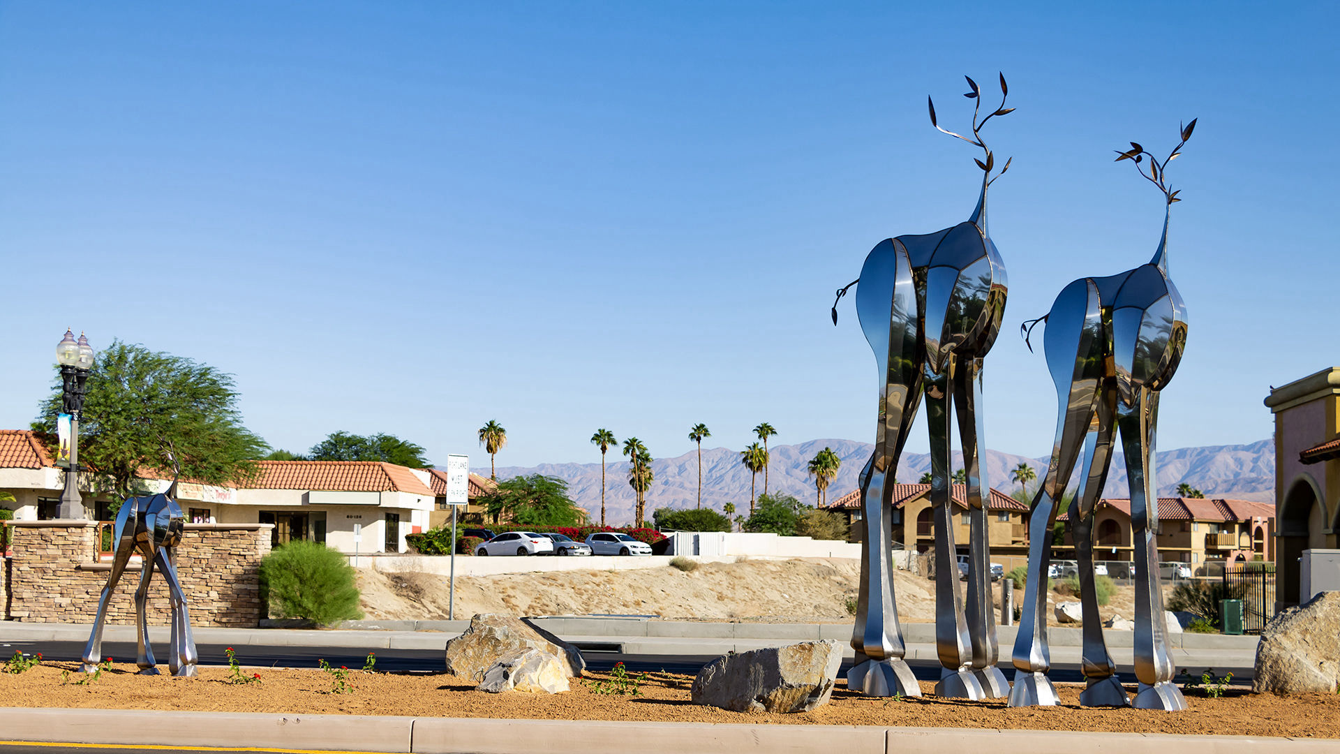 Sequitur — mirror-polished stainless steel public art sculpture by Heath Satow, Indio, CA