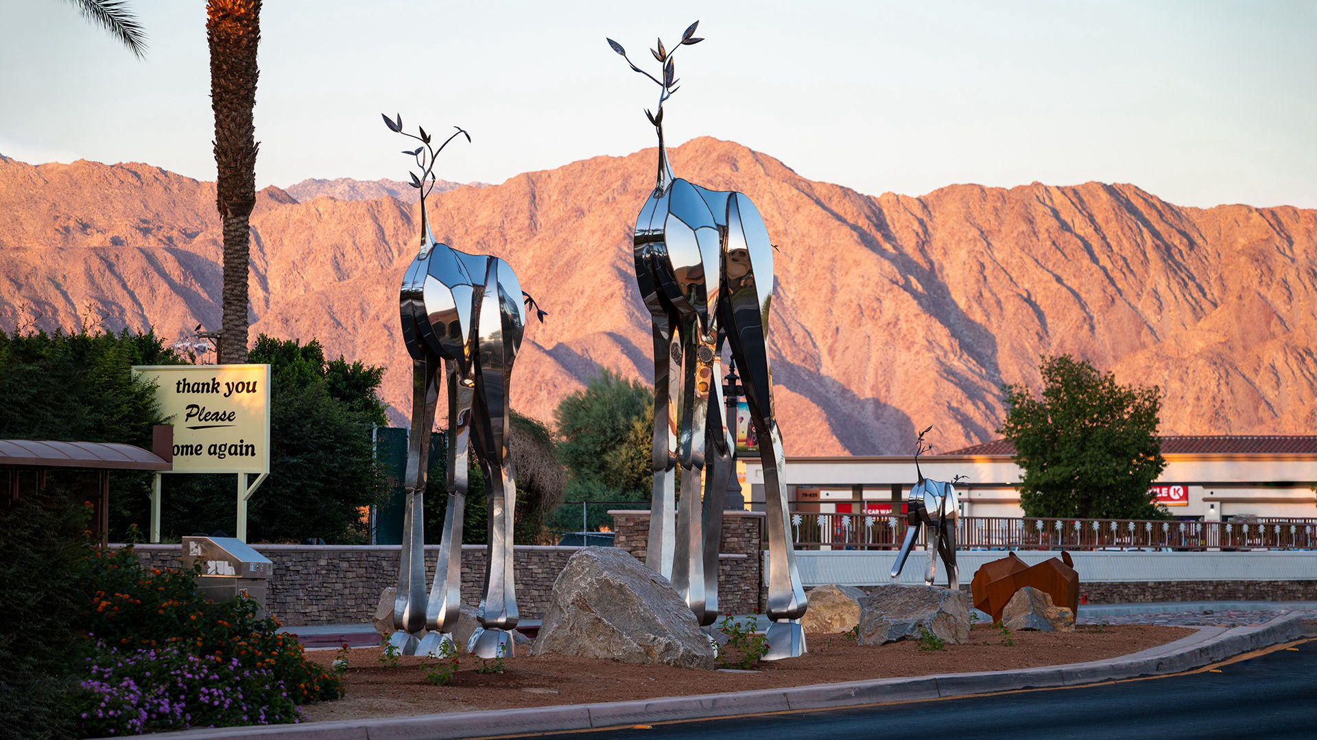 Sequitur — mirror-polished stainless steel public art sculpture by Heath Satow, Indio, CA