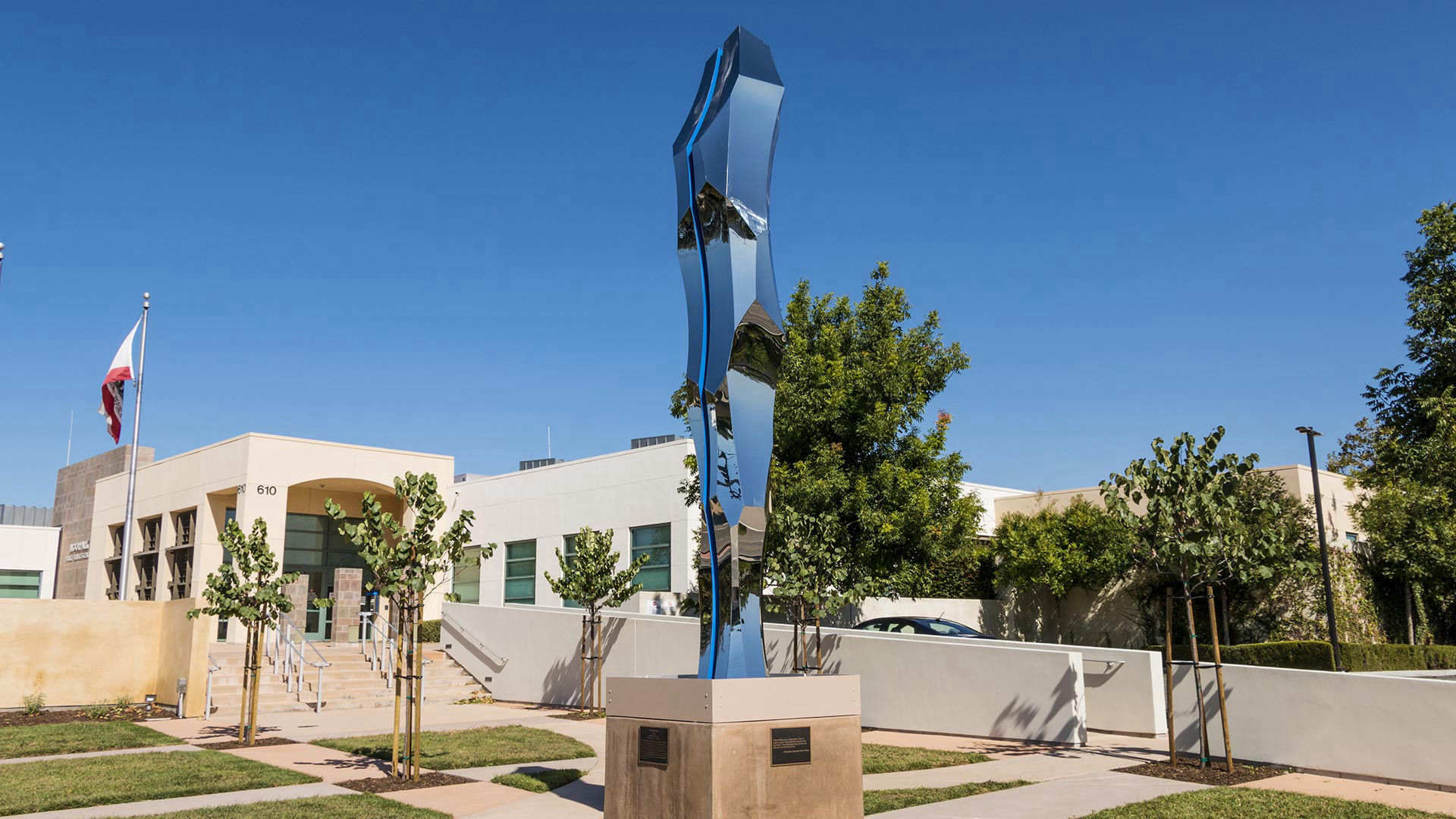 Thin Blue Line — mirror-polished stainless steel and LED lighting public art sculpture by Heath Satow, Moorpark, CA