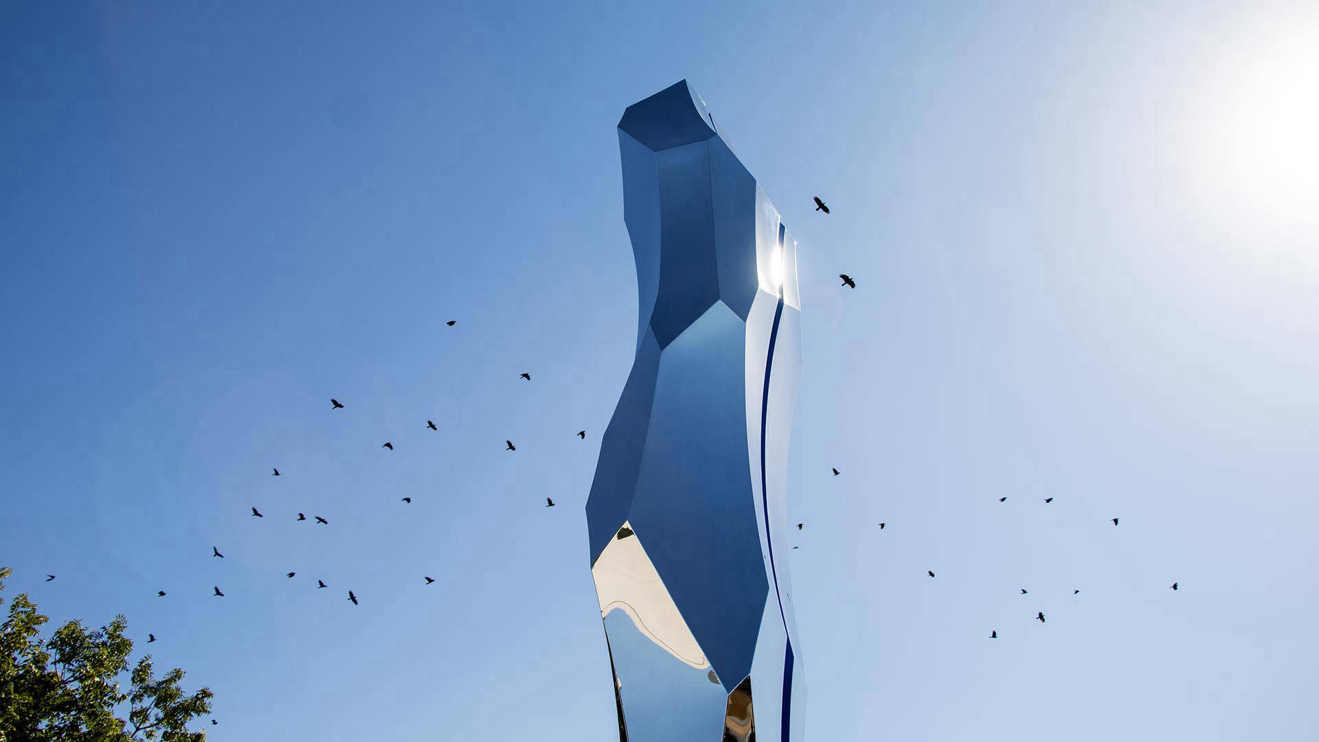 Thin Blue Line — mirror-polished stainless steel and LED lighting public art sculpture by Heath Satow, Moorpark, CA