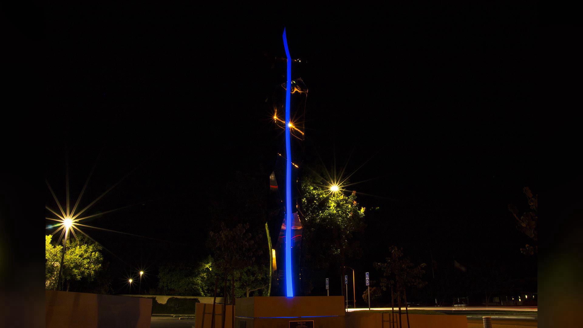 Thin Blue Line — mirror-polished stainless steel and LED lighting public art sculpture by Heath Satow, Moorpark, CA