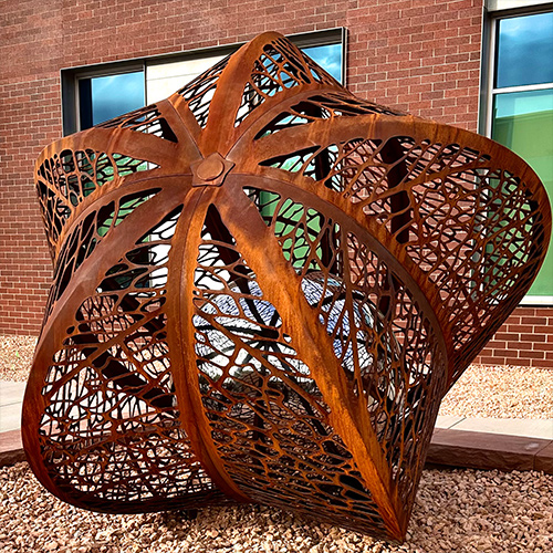 Seed — corten and mirror-polished stainless steel public art sculpture by Heath Satow, Cedar City, UT