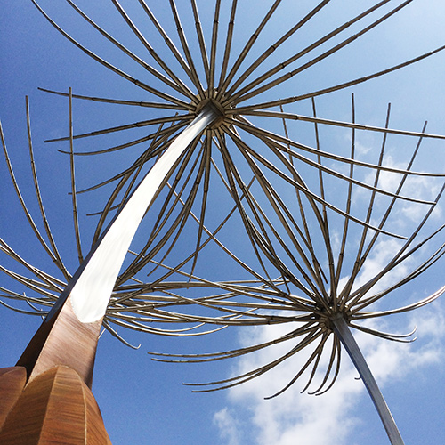 Wish — stainless steel and corten dandelion public art sculpture by Heath Satow